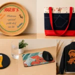 Créations personnalisées artisanales réalisées par Les Créations de Maïwen : plateau en bois personnalisé, sac cousu main, sous-verre, tapis de souris sublimé et veste personnalisée.